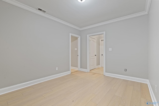 119 Railway Ln SE, Huntsville, AL 35803 - empty room with crown molding, baseboards, and light wood finished floors