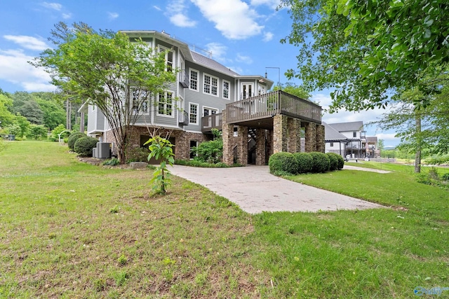 119 Railway Ln SE, Huntsville, AL 35803 - view of front of house featuring a front lawn, a deck, and central AC unit
