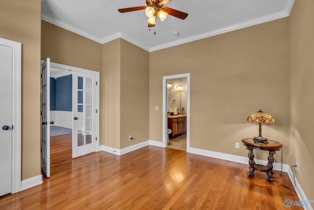 unfurnished bedroom with french doors, ornamental molding, and light hardwood / wood-style floors