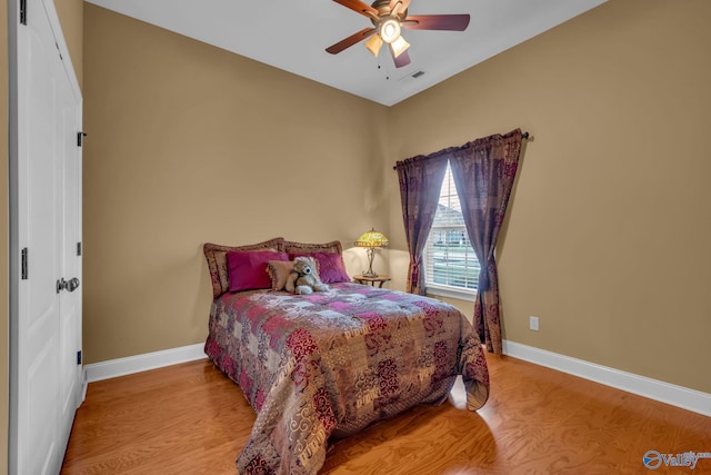 bedroom featuring light hardwood / wood-style flooring and ceiling fan