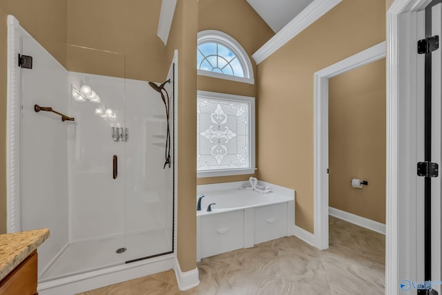 bathroom with vanity, separate shower and tub, and vaulted ceiling