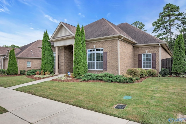 1006 Split Rock Cv, Huntsville, AL 35806 - ranch-style house with brick siding, a shingled roof, and a front yard