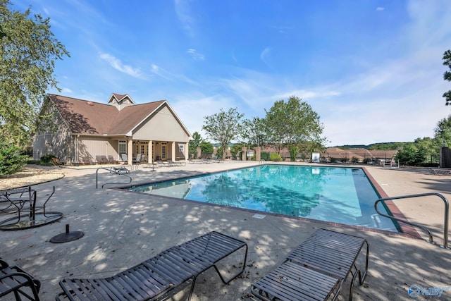 view of swimming pool featuring a patio area