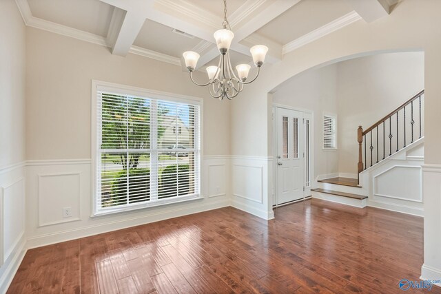 unfurnished dining area with arched walkways, hardwood / wood-style flooring, beamed ceiling, a chandelier, and coffered ceiling