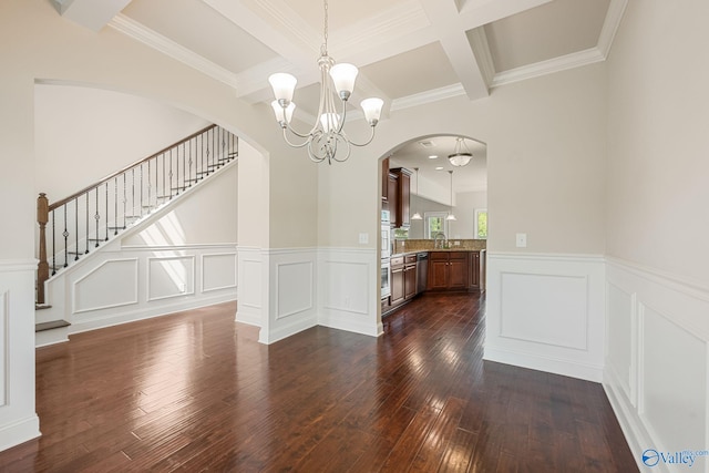 unfurnished dining area featuring arched walkways, beamed ceiling, dark wood-style flooring, and a notable chandelier