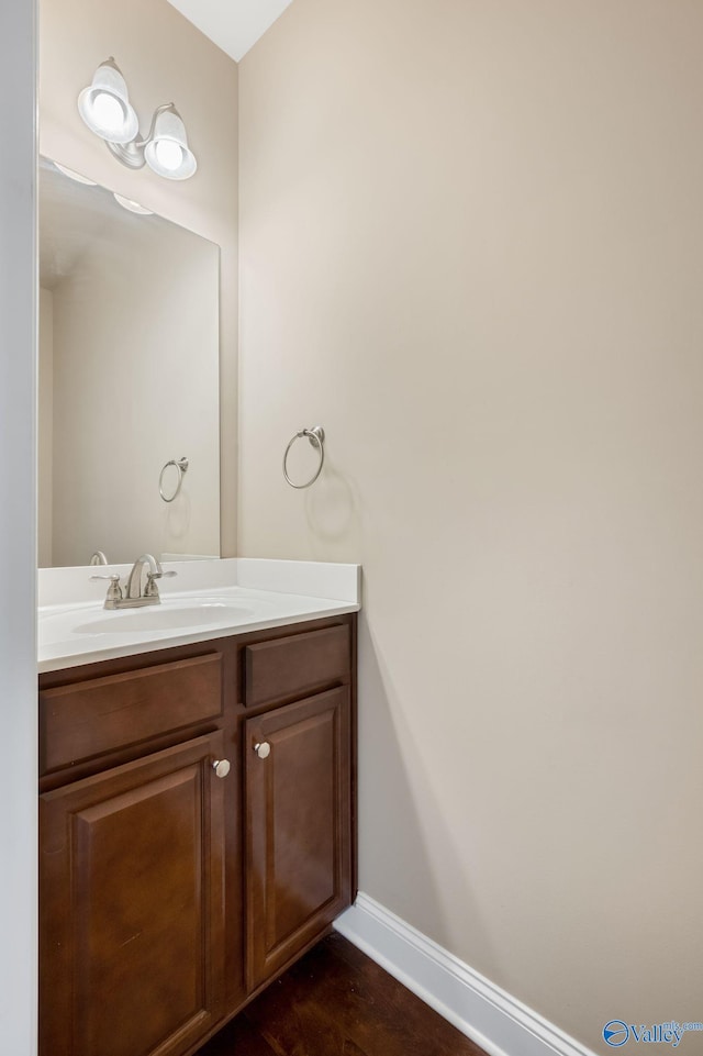 bathroom featuring vanity and baseboards