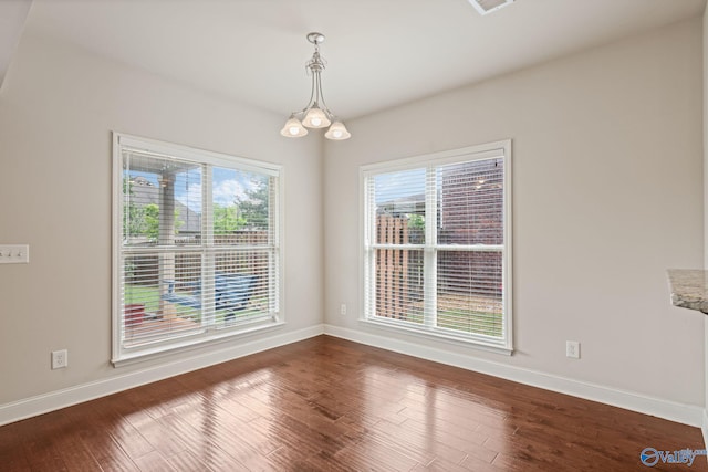 unfurnished dining area with baseboards and a healthy amount of sunlight