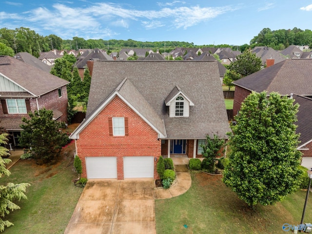 view of front of property with brick siding, a shingled roof, a residential view, and concrete driveway