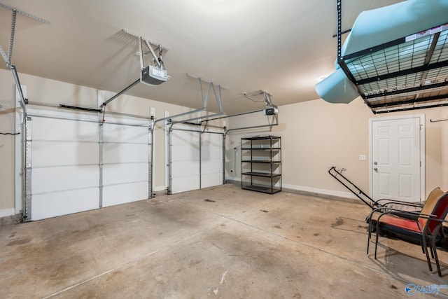 garage featuring baseboards and a garage door opener