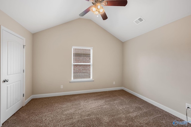 unfurnished room with a ceiling fan, visible vents, baseboards, lofted ceiling, and carpet