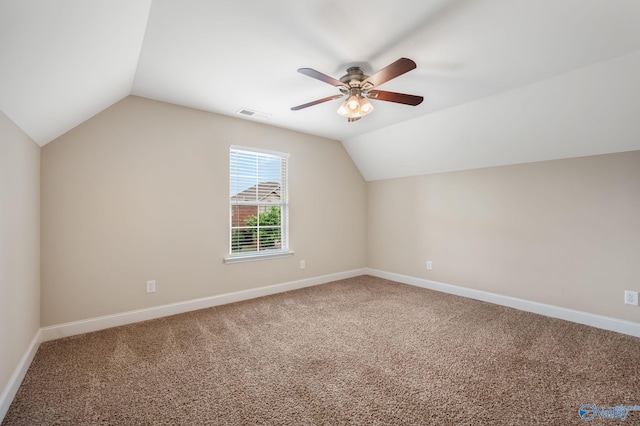 bonus room featuring ceiling fan, carpet, lofted ceiling, and visible vents