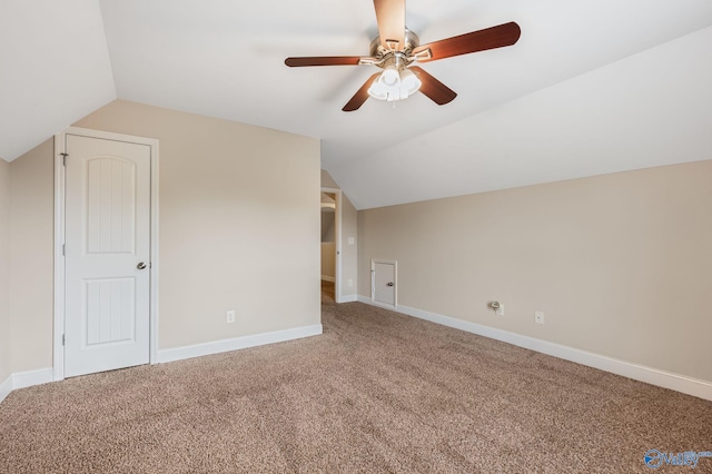 bonus room featuring baseboards, carpet flooring, ceiling fan, and lofted ceiling