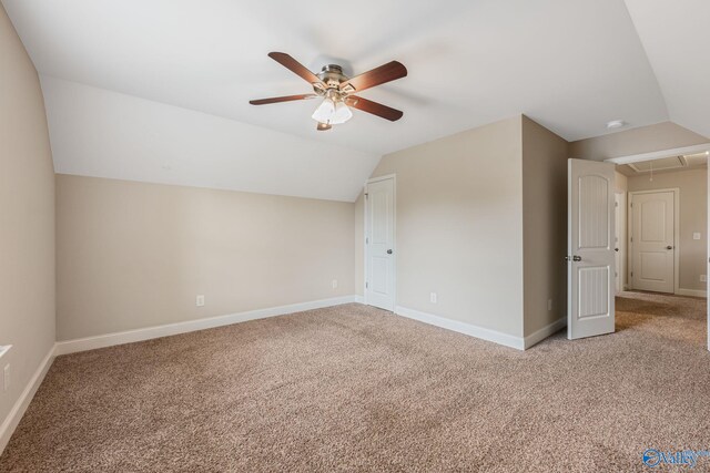 bonus room with ceiling fan, lofted ceiling, and light colored carpet