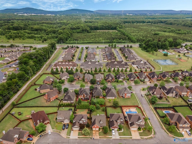 bird's eye view with a view of trees, a mountain view, and a residential view