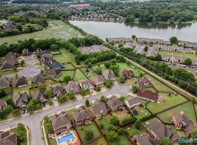 bird's eye view featuring a water view and a residential view