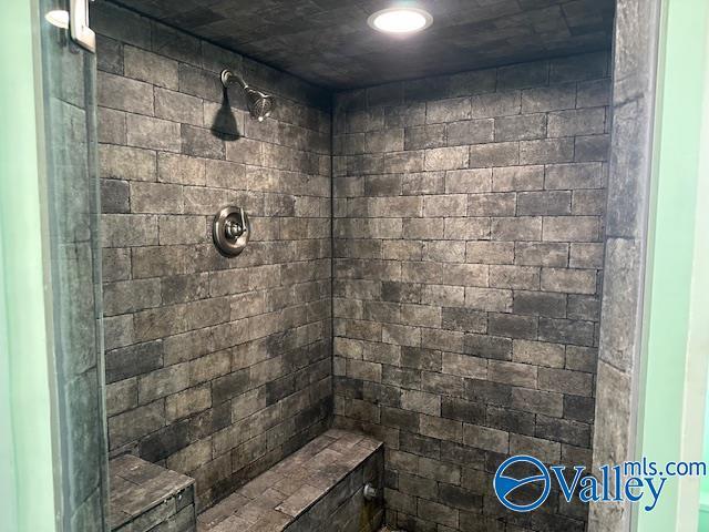 full bathroom with tiled shower