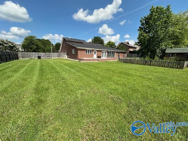 view of yard with a fenced backyard