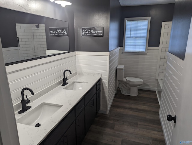 2537 Rexford St, Gadsden, AL 35903 - full bath featuring wainscoting, double vanity, wood finished floors, and a shower