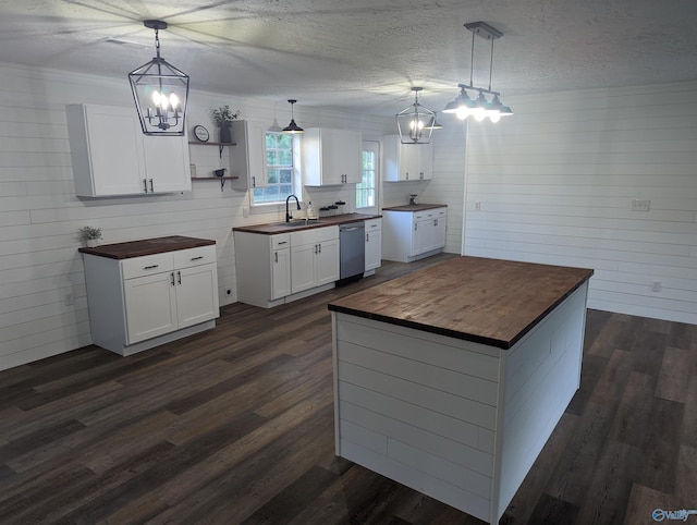 2537 Rexford St, Gadsden, AL 35903 - kitchen with wooden counters, a chandelier, dishwasher, dark wood finished floors, and a textured ceiling