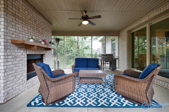 exterior space with a grill, an outdoor living space with a fireplace, and ceiling fan