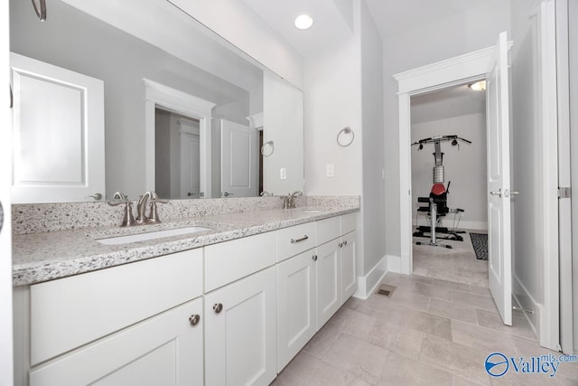 bathroom with tile patterned flooring and vanity