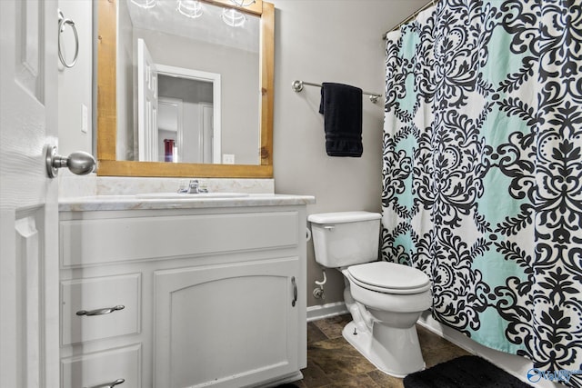 bathroom featuring toilet and vanity