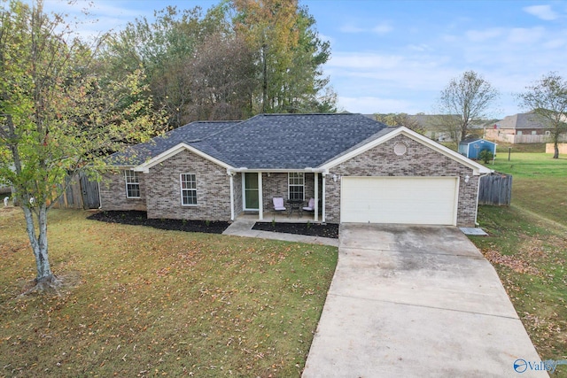 ranch-style house with a garage and a front yard