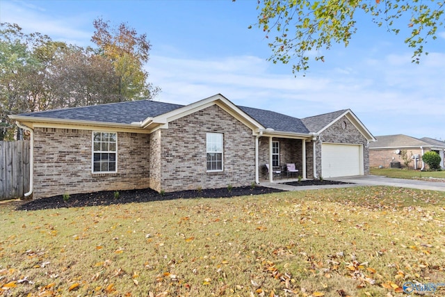 ranch-style house featuring a garage and a front yard