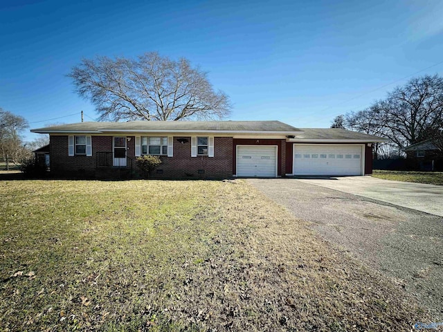 ranch-style home featuring a front lawn and a garage