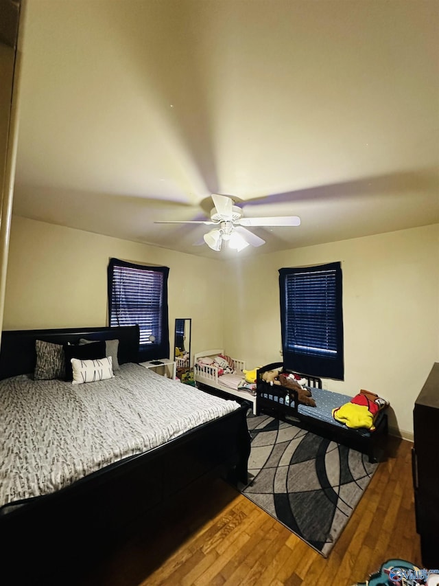 bedroom featuring ceiling fan and wood-type flooring