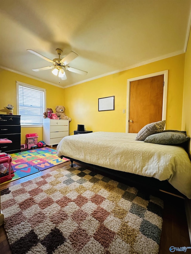 bedroom featuring ceiling fan and crown molding