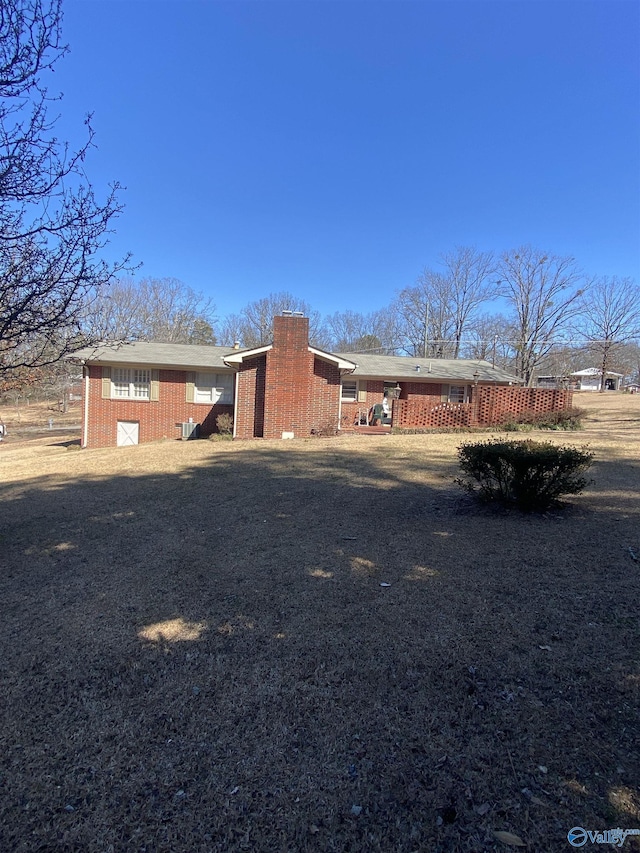 view of front of home featuring a chimney