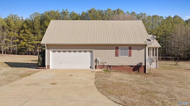 view of front of property with a garage and a front lawn