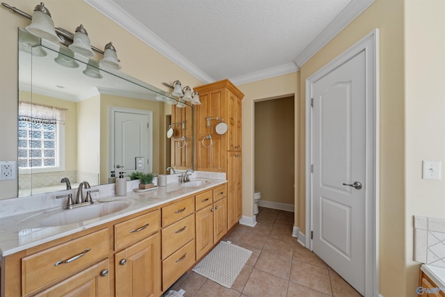 bathroom with tile patterned floors, ornamental molding, toilet, and vanity