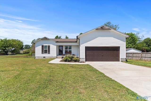 ranch-style house featuring concrete driveway, an attached garage, fence, and a front yard