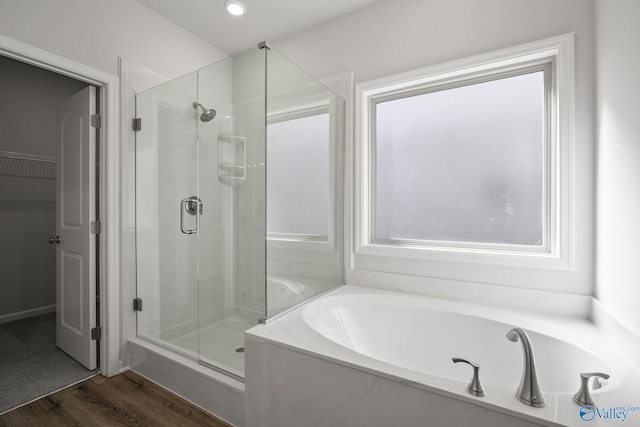 418 Tracer St, Huntsville, AL 35811 - full bath with a shower stall, a garden tub, wood finished floors, recessed lighting, and a spacious closet