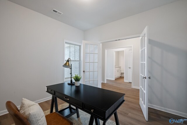 418 Tracer St, Huntsville, AL 35811 - office space featuring french doors, baseboards, and wood finished floors