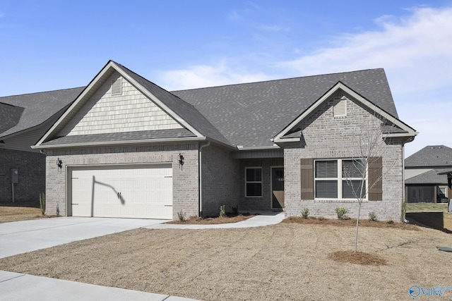 418 Tracer St, Huntsville, AL 35811 - view of front of property with an attached garage, brick siding, driveway, and roof with shingles