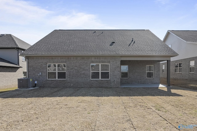 418 Tracer St, Huntsville, AL 35811 - back of property with a patio, brick siding, roof with shingles, and cooling unit
