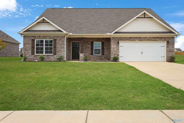 craftsman house featuring a garage and a front lawn