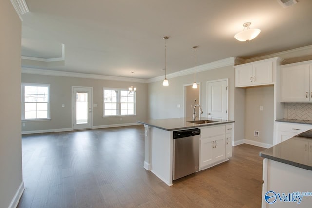 kitchen featuring sink, dishwasher, tasteful backsplash, an island with sink, and white cabinets