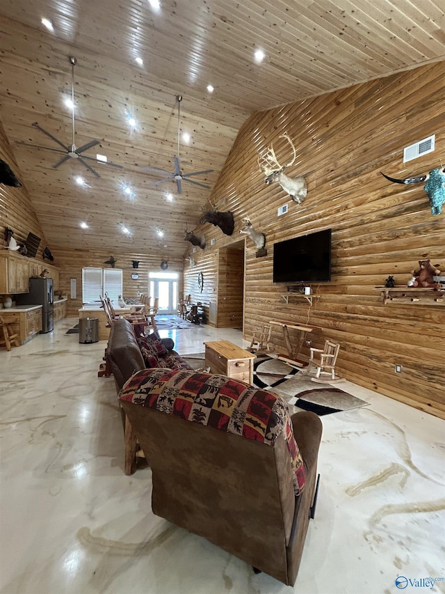 living room with ceiling fan, wood ceiling, high vaulted ceiling, and wood walls