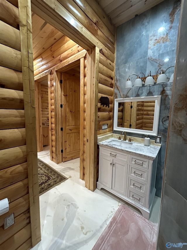 bathroom with vanity, rustic walls, and wood ceiling