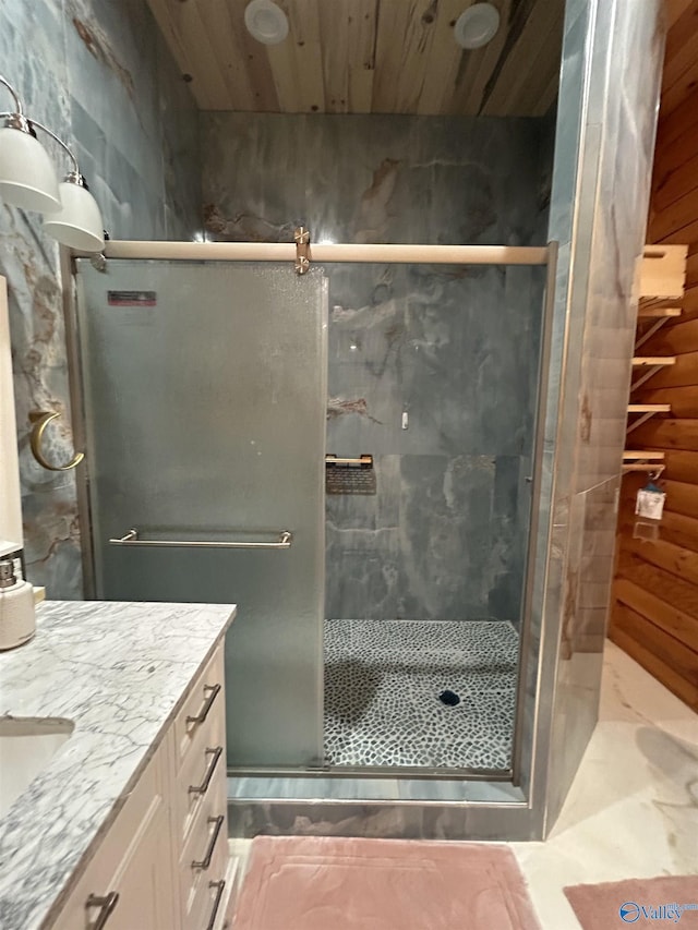 bathroom featuring vanity, wooden walls, an enclosed shower, and wood ceiling