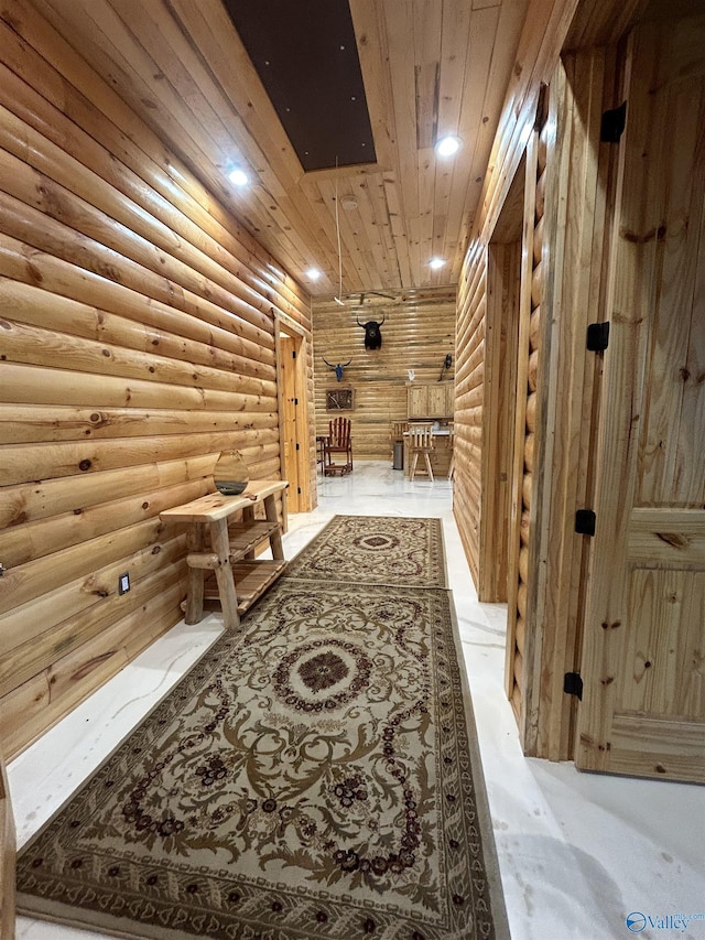 corridor featuring wooden ceiling and log walls