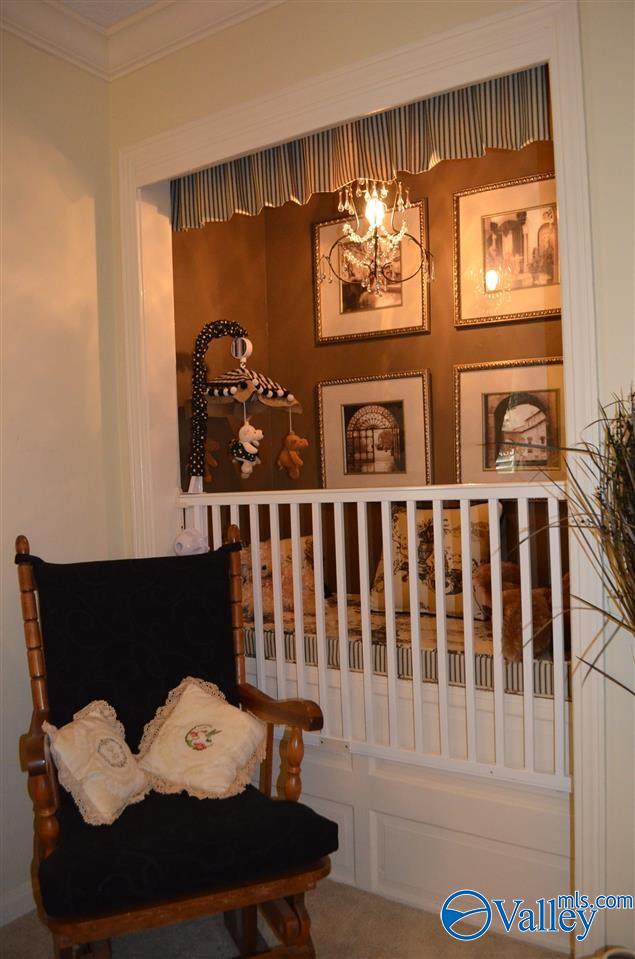 interior space featuring ornamental molding and a chandelier