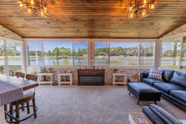 sunroom featuring a chandelier, wooden ceiling, and lofted ceiling