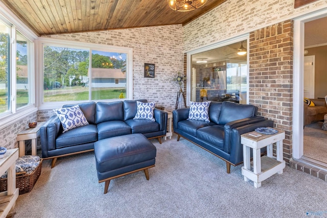 carpeted living area with crown molding, wooden ceiling, plenty of natural light, and lofted ceiling