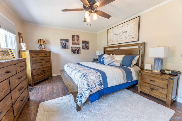 bedroom with baseboards, ornamental molding, a ceiling fan, and dark wood finished floors