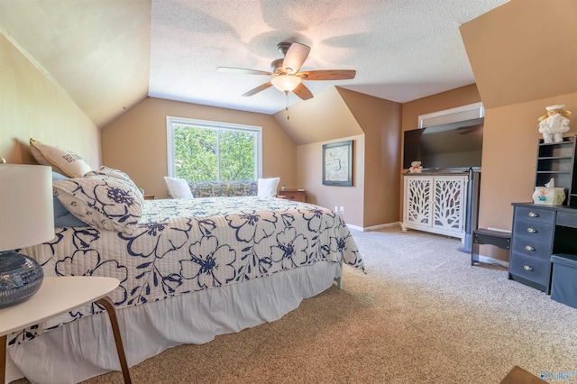 bedroom featuring baseboards, lofted ceiling, ceiling fan, and carpet